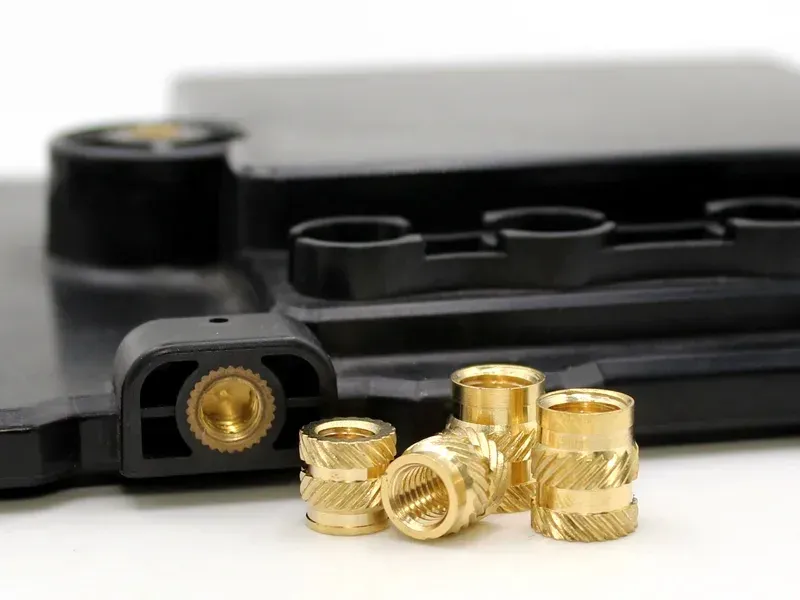 kravzik-insert-molding-mechanical-retention-anchoring-features
